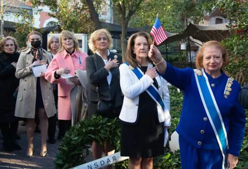 Members of the Daughters of the American Revolution pay tribute to the US flag during the tribute to the Spanish contribution to the US at the Casa de América in Madrid